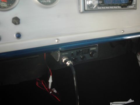 1978 Ford Bronco - Interior view of a vehicle's dashboard, a CB radio and gauges.