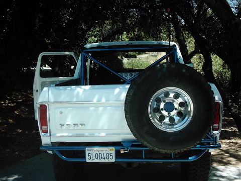 1978 Ford Bronco - Rear view of a 1978 Ford Bronco, modified with a roll cage and spare tire carrier.