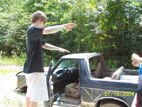 1987 Ford Bronco - This 1987 Ford Bronco is seen in a wooded area with its doors open.