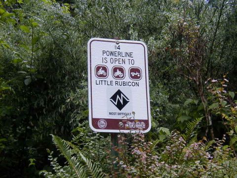 1994 Ford Explorer - Sign for trail access with icons for different vehicle types.