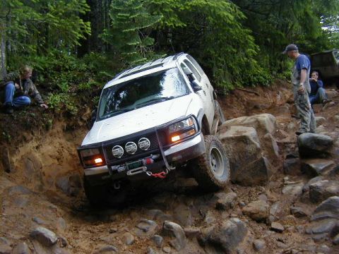1994 Ford Explorer - This 1994 Ford Explorer is tackling a challenging rocky terrain on an off-road adventure.