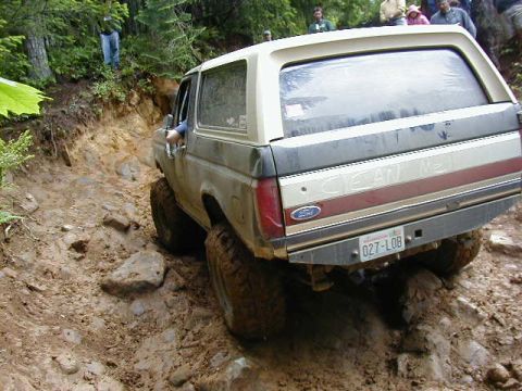 1994 Ford Explorer - This Ford Bronco navigates a challenging off-road trail, its capabilities.
