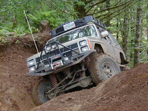 1994 Ford Explorer - This 1994 Ford Explorer navigates a challenging off-road trail, demonstrating its capabilities.