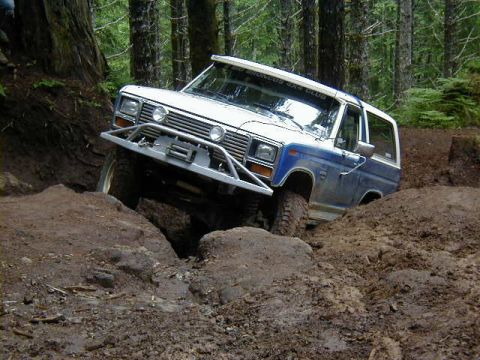 1994 Ford Explorer - This SUV is tackling a challenging off-road course with steep inclines and rough terrain.