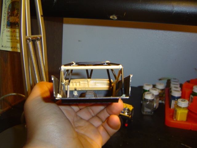 Model car interior with roll cage and dashboard