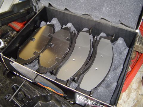 1989 Ford Bronco - New brake pads are packaged in a box with foam inserts for protection.
