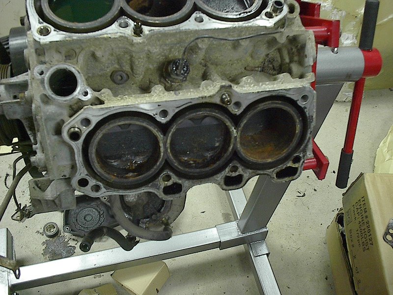 Disassembled V6 engine block mounted on an engine stand