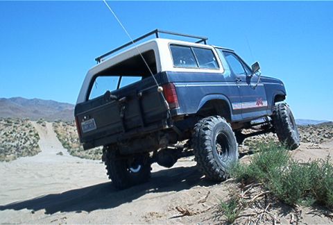 1986 Ford Bronco - This 1986 Ford Bronco is tackling sandy terrain with its off-road modifications.