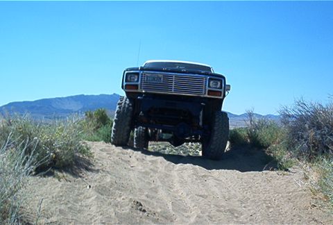 1986 Ford Bronco - This 1986 Ford Bronco is shown tackling a sandy incline off-road.