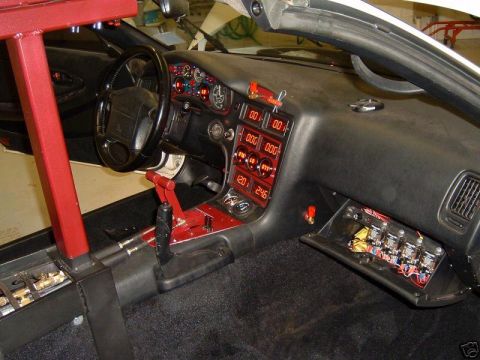 1988 Ford Bronco - Custom digital gauges and a red roll cage are visible in this car's interior.