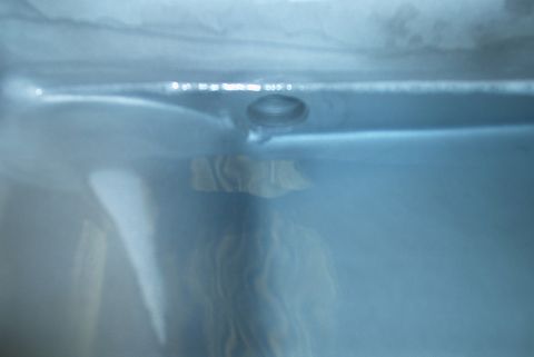 1983 Ford Bronco - This is a close-up view of a transmission drain plug, likely taken during maintenance or repair.