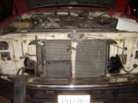 1992 Ford Bronco - Front view of a 1992 Ford Bronco's engine bay, showing the radiator and surrounding components.