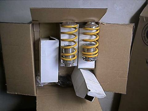 1996 Ford Probe - Four suspension springs are shown packed in a cardboard box, ready for installation or shipping.