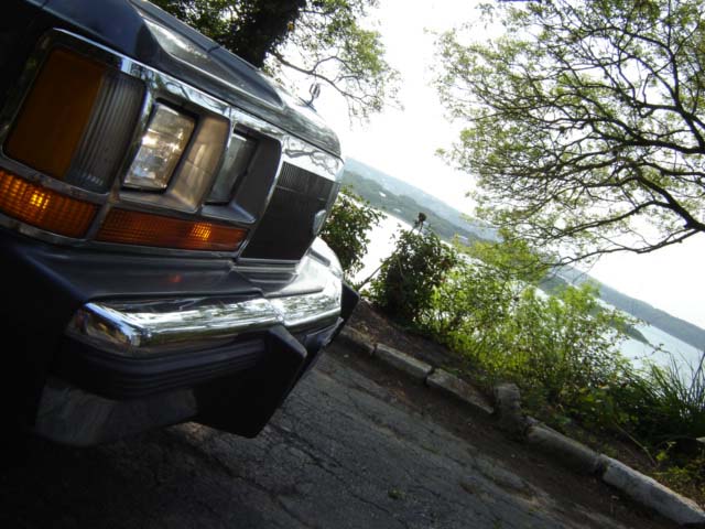 1988 Ford Crown Victoria LTD front end with chrome bumper and grille, angled view