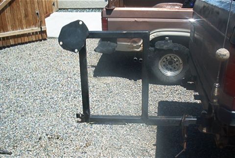 1986 Ford Bronco - I took the studs out of the tire carrier portion and cut the lips on the gas can holders lower so the can lip would hold the weight .