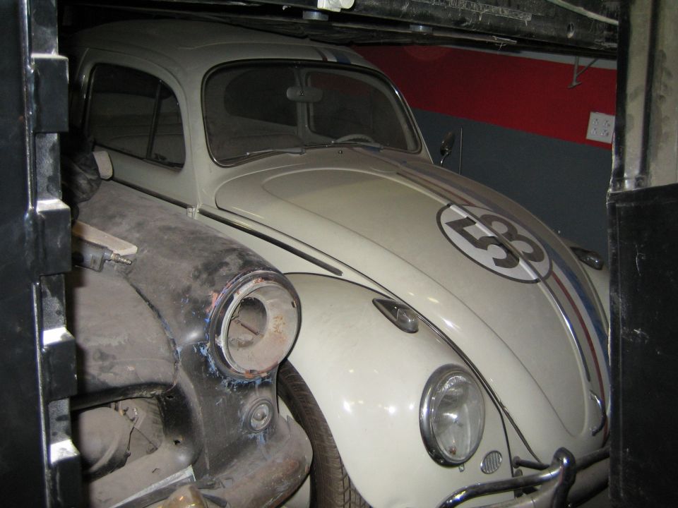 White Volkswagen Beetle with racing stripes and number 53 on the hood