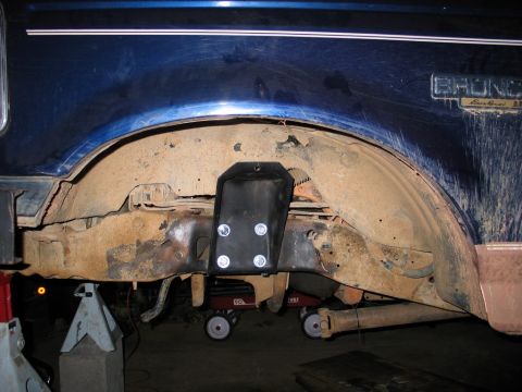 1995 Ford Bronco - Rear suspension modification on a 1995 Ford Bronco, showing the axle and new bracket.