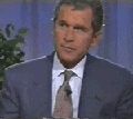 1968 Ford Mustang - George W. Bush is seen in a formal suit and tie during what appears to be a televised interview.