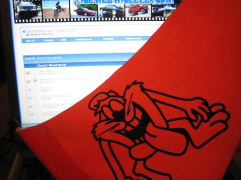1990 Ford Bronco - red vinyl cutout of a cartoon devil character in front of a monitor displaying TheWebWheeler.com forum.