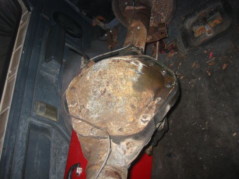 1989 Ford Bronco - A rusty rear differential assembly is visible in the cargo area of a vehicle, likely for repair or replacement.