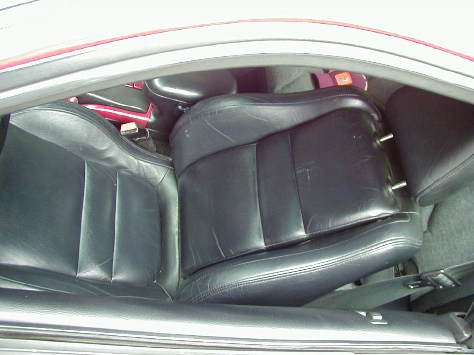 Black leather car seats, interior view