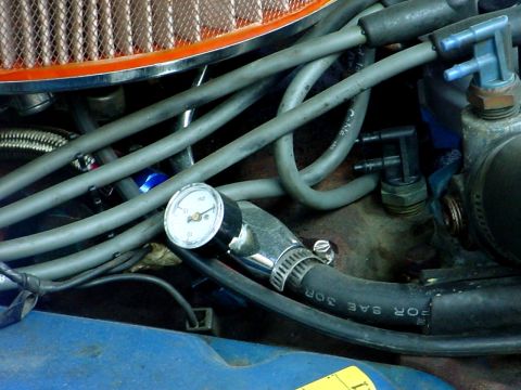 1973 Ford Ranchero - Engine bay detail with a fuel pressure gauge installed on a hose.