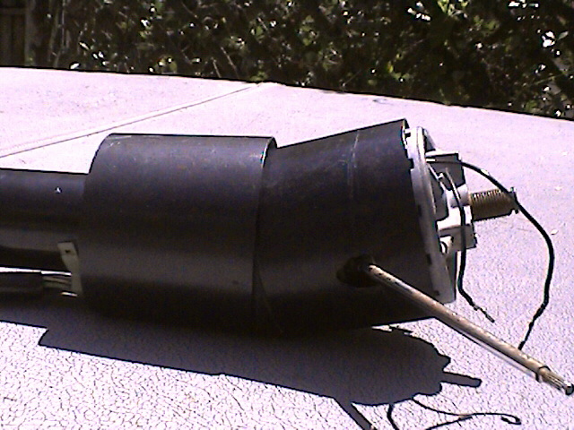 Black steering column part with wires and metal rod