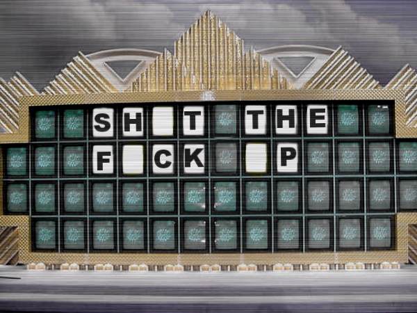 Wheel of Fortune style puzzle board made of CRT screens spelling a joke phrase