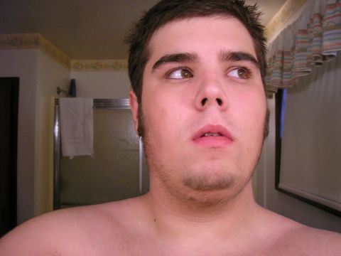 1990 Ford Probe - Man's face in a bathroom setting, looking away from the camera.
