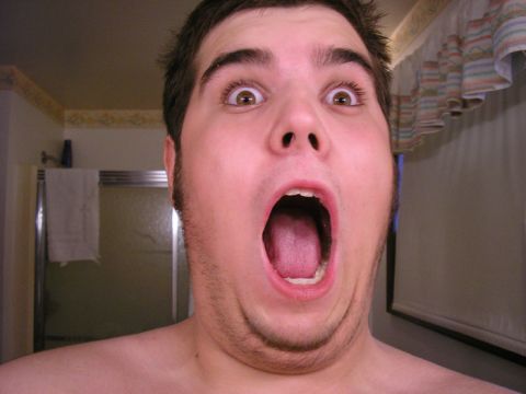 1990 Ford Probe - A man makes a surprised face with his mouth wide open.