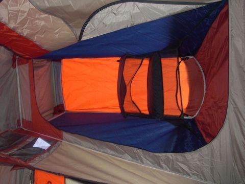 1997 Ford Probe - The interior of a tent shows multiple fabric colors and mesh window coverings.