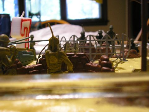 1990 Ford Probe - A diorama scene depicts toy soldiers in a battle formation, complete with a birthday candle and a website logo.