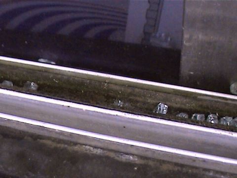 1978 Ford Bronco - Small pieces of broken glass are visible in the window channel.