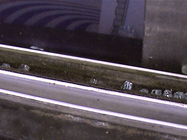 Broken glass shards in a window channel