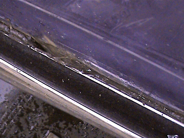 close-up of a dirty, worn door seal on a vehicle