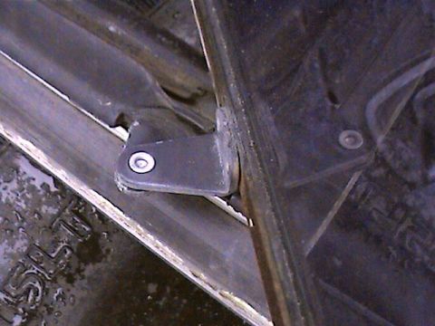 1978 Ford Bronco - This photo shows a close-up of a vehicle's door hinge bracket, not a 1978 Ford Bronco.