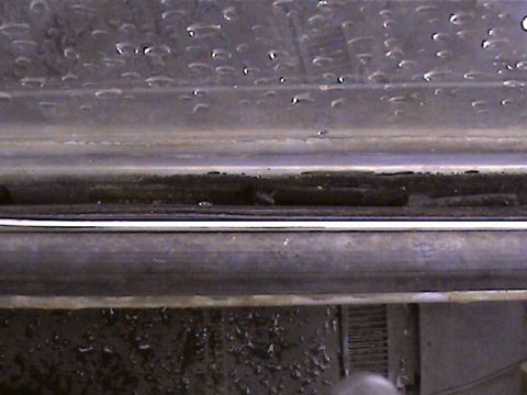 1978 Ford Bronco - The bottom edge of a vehicle door, showing the sill and surrounding trim.