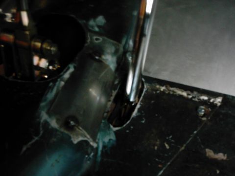 1978 Ford Bronco - Detail of vehicle interior components, including metal tubing and flooring, with visible welding and sealant.