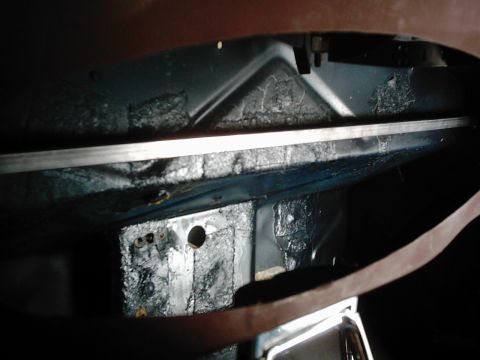 1978 Ford Bronco - Close-up view of the undercarriage, revealing structural components and protective coatings.