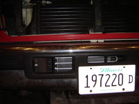 1992 Ford Bronco - Front bumper detail with an Illinois license plate and visible radiator fins.