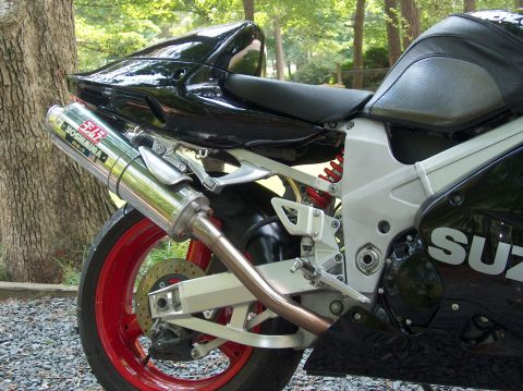 2002 Suzuki TL1000R - Motorcycle rear view showing Yoshimura exhaust and red wheel.