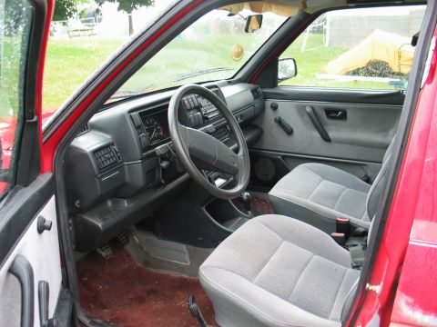 1991 Volkswagen Golf - Interior view of a 1991 Volkswagen Golf, showing the dashboard, steering wheel, and front seats.