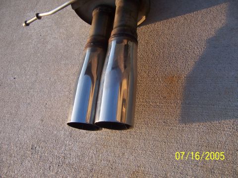 1994 Ford Probe - Dual exhaust tips are visible against a concrete background with a timestamp of 07/16/2005.