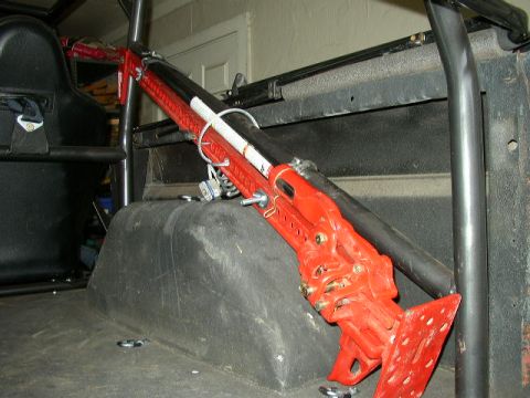 1995 Ford Bronco - A hi-lift jack is mounted inside the vehicle, ready for off-road use.