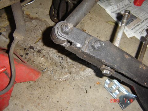 1993 Ford Bronco - A close-up view of a vehicle's suspension part, showing wear and tear.