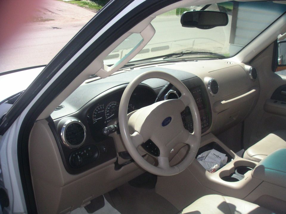 Interior view of a 2003 Ford Expedition showing the dashboard, steering wheel, and center console