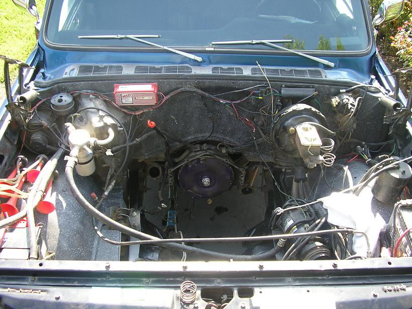 Blue 1979 Chevrolet C/K Pickup engine bay with exposed wiring and components