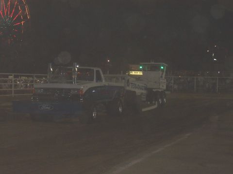 1994 Ford F-150 - Ford F-150 towing a trailer at night, with fireworks overhead.
