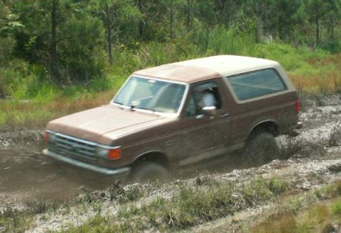 1988 Ford Bronco - This 1988 Ford Bronco navigates a muddy off-road course.