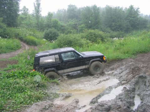 1986 Ford Bronco - my buddy Jay coming out through the ditch/stream .. got stuck going in